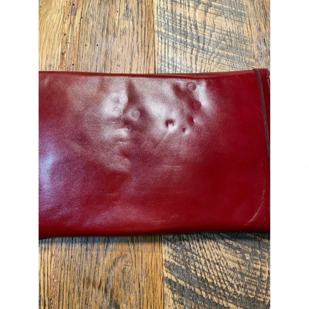 Elegant Burgundy Etienne Aigner Leather Clutch Handbag‎ with Gold Oval Accent
